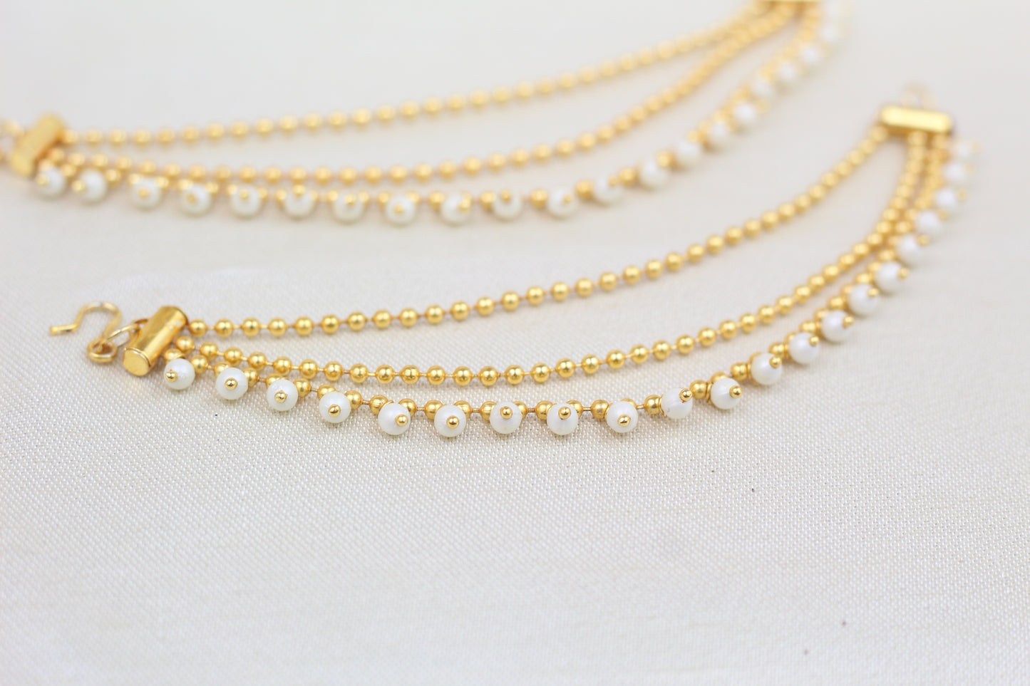 GOLD FINISH TRIPLE CHAIN WITH PEARL SAHARE