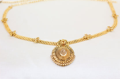 GOLD WAIST BELT WITH OVAL PENDANT